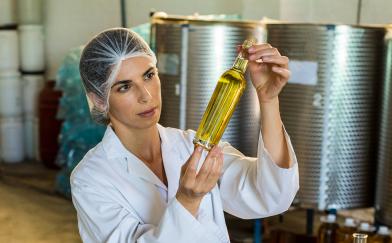 technician examining olive oil